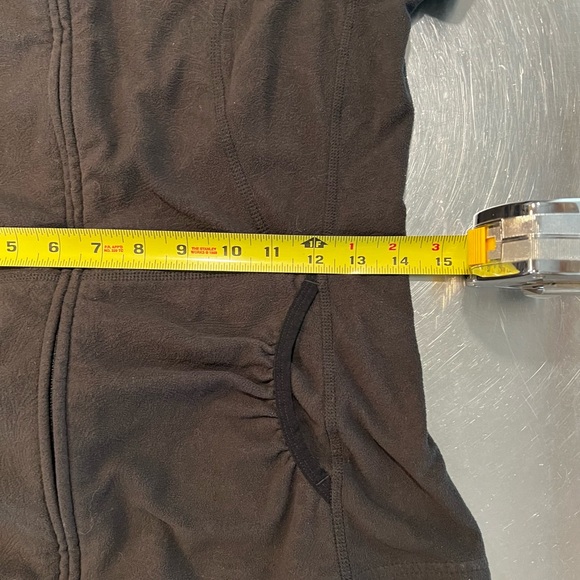 North face Small, embossed pattern, black fleece, front pockets with hood. - Picture 13 of 15